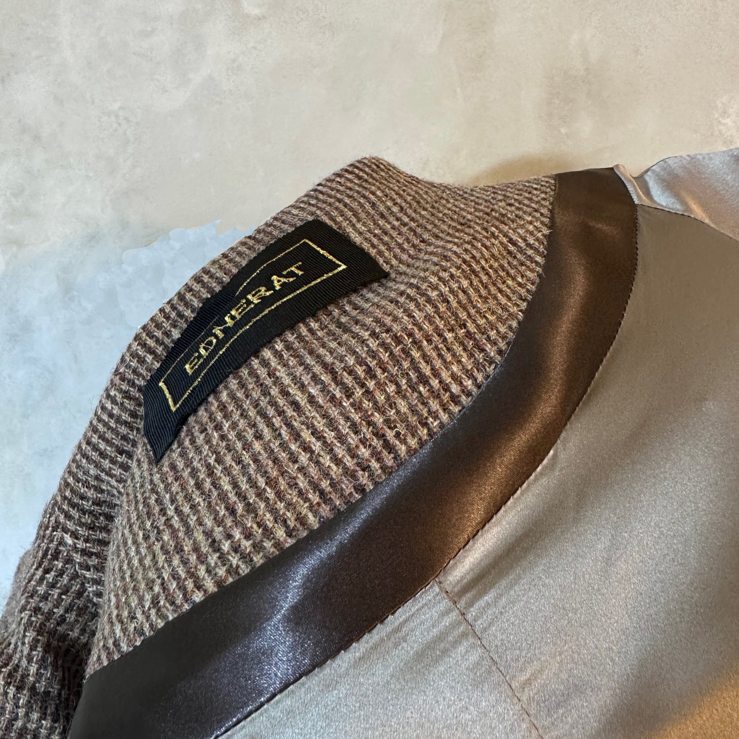 Longer Length Brown Tweed Cocoon Coat. A superbly warm and elegant coat - perfect for dressing up and wrapping up in winter. An investment piece that will last through the years. Handmade in Britain. Collar Close up showing black label, satin trim and matching silk lining.