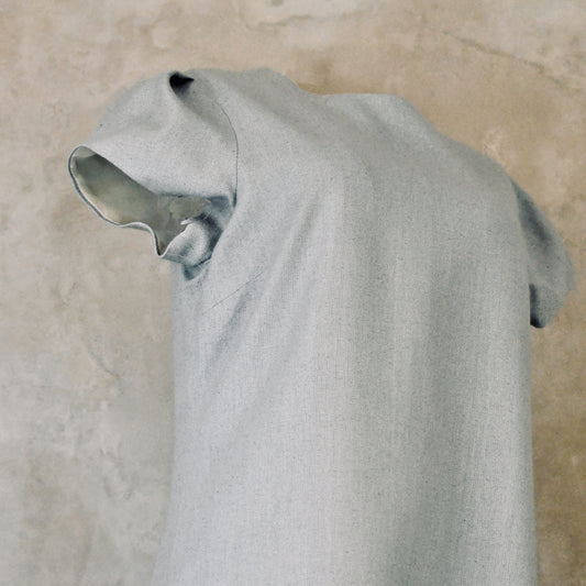 An A-Line Bell Sleeve Coat and Dress in Light Blue Silk Matka. A long, short-sleeved blue woven dress with an A-Line cut. Handmade in Britain. Dress Sleeve Detail.