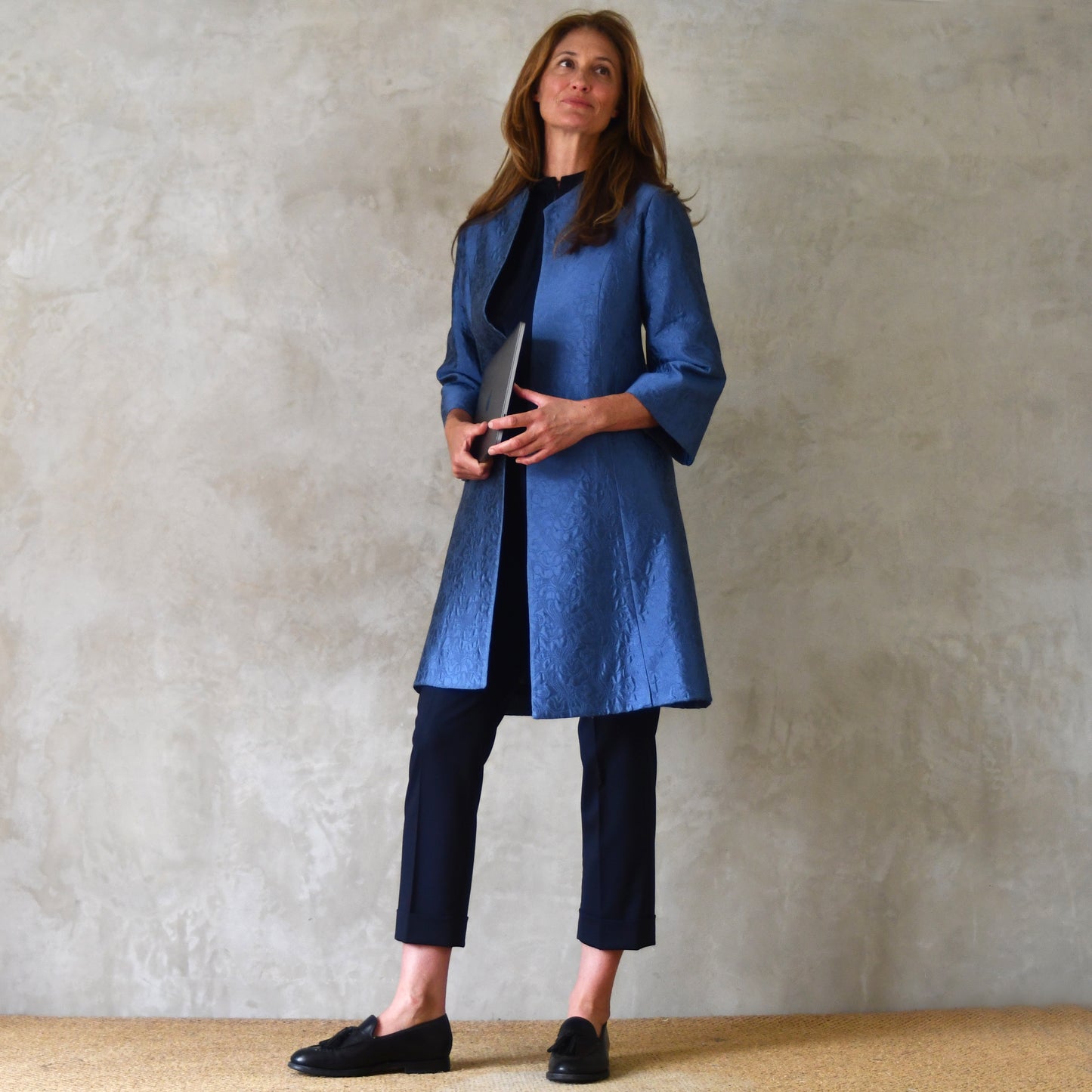 Trapeze Swing Coat in Limited Edition Blue Flower Brocade. This is a Bespoke MidLength Swing Coat with slight vintage feel and flattering seaming details to front and rear. Handmade in Britain. Closed View.