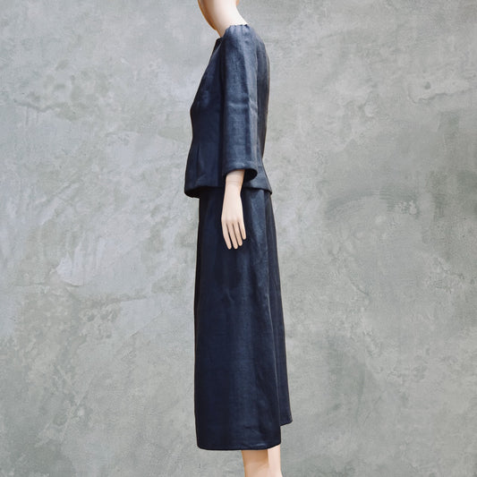 Side view of bespoke Navy Tailored Linen Skirt Suit showing boatneck peplum shaped cop over longer length A-Line Skirt. Cut, Made and Finished by Hand n London, bespoke lengths and sizes are also available.