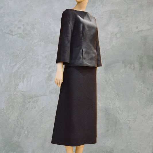 Pure Silk Tailored Summer Skirt Suit in dark navy blue. A boatneck top with a gentle peplum shape sits atop a longer length A-Line skirt. Both fully lined in Silk and handmade in London. Bespoke skirt suits are also available.