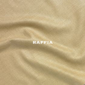 Close-up of a textured, pale yellow woven silk from the Bespoke Silk Matka Bell Sleeve A-Line Coat. Handmade in Britain.