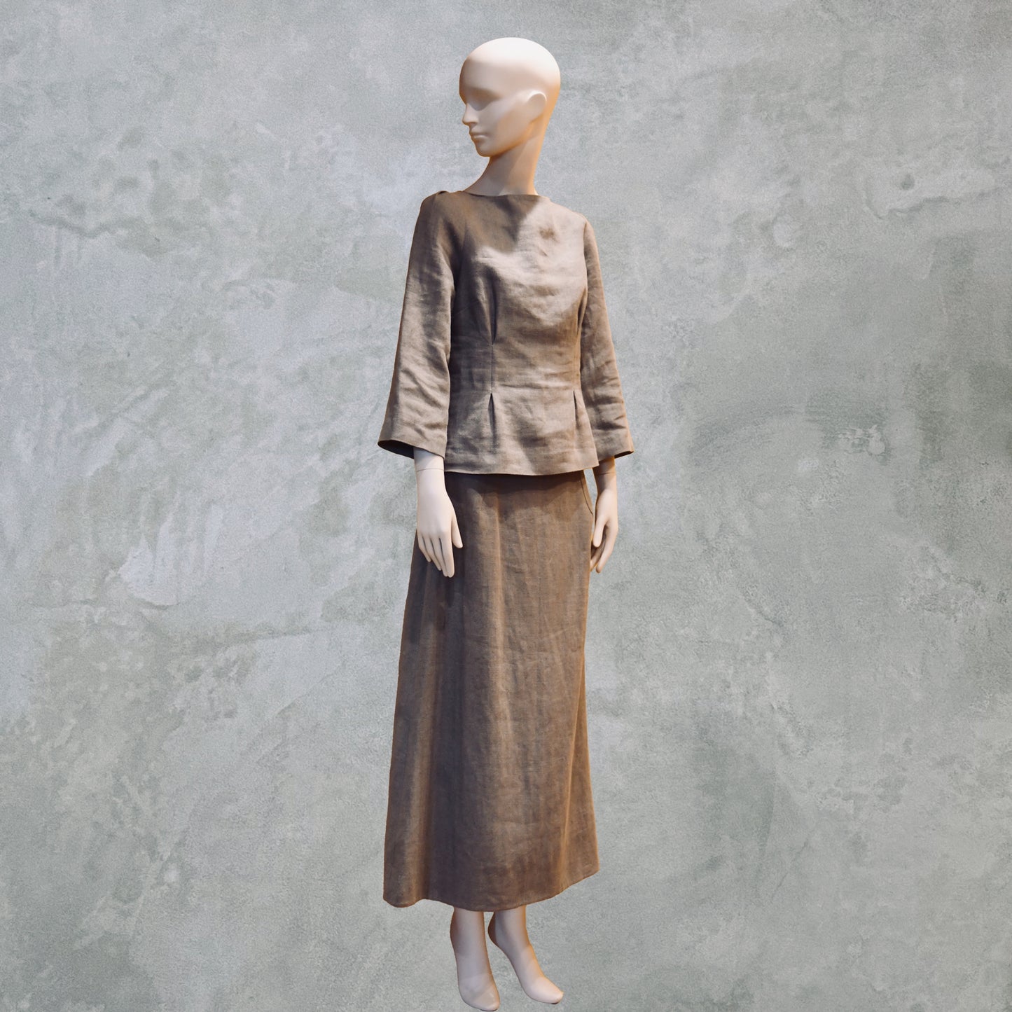 A Tailored Boat Neck Skirt Suit in Brown Midweight Irish Linen, featuring an a-line skirt and boat neck blouse. Made by Hand in Great Britain.