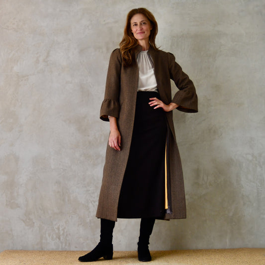 Longer Length Bell Sleeve A-Line Coat in Dark Brown Cashmere Mix. Frill Cuffs, shoulder details and a Mandarin collar top of this very special coat – perfect for racing. Entirely made in Britain.