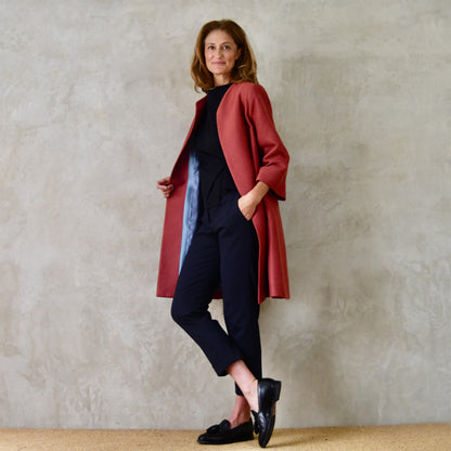 Trapeze Swing Coat in Limited Edition Rust Corn Brocade. A bespoke  Elegant Spring or Work MidLength Swing Coat with slight vintage feel and flattering seaming details to front and rear. Entirely made in Great Britain. Side View showing rich blue silk lining.