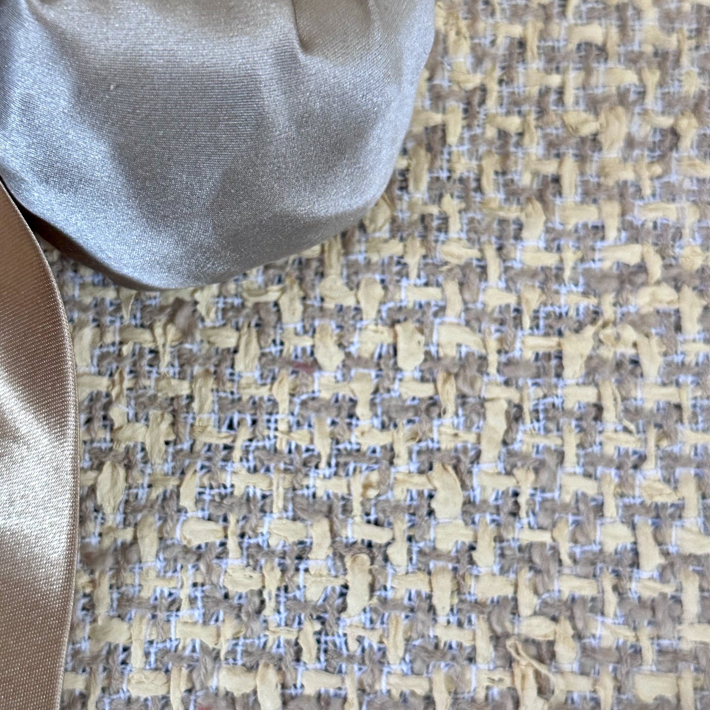 A Tailored Boat Neck Suit in Sand Mix Boucle from Linton Tweeds. Handmade in Britain. Fabric Close Up.