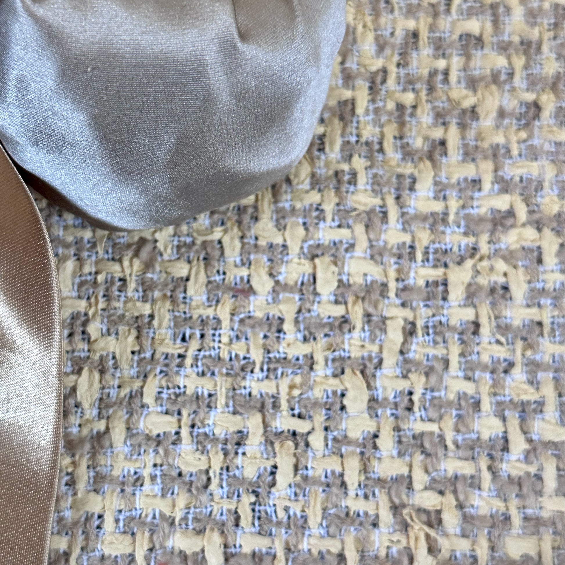 A Tailored Boat Neck Suit in Sand Mix Boucle from Linton Tweeds. Handmade in Britain. Fabric Close Up.