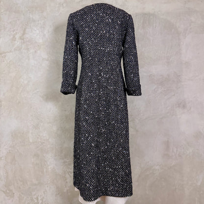Tailored Hourglass Coat in Metallic Linton Tweeds Boucle. A Longer Length Fitted Bouclé Coat perfect for Evening Wear. An investment piece in the opera coat tradition.
Handmade in Britain. Rear View.