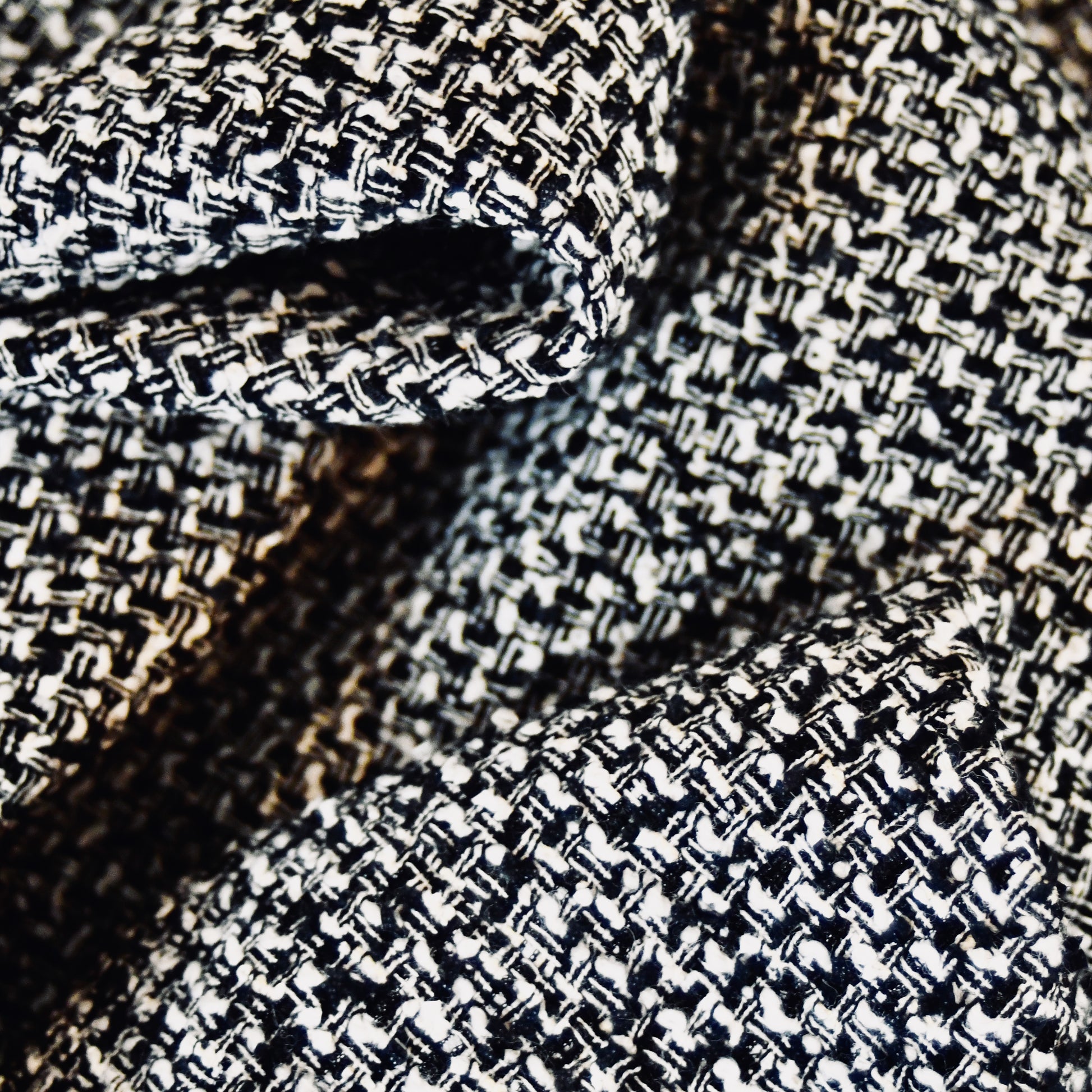 Fitted Longline Hourglass Coat in Linton Tweeds Black and White Boucle. An investment piece for Ascot, Weddings and Work. Handmade in Britain. Fabric Close Up.