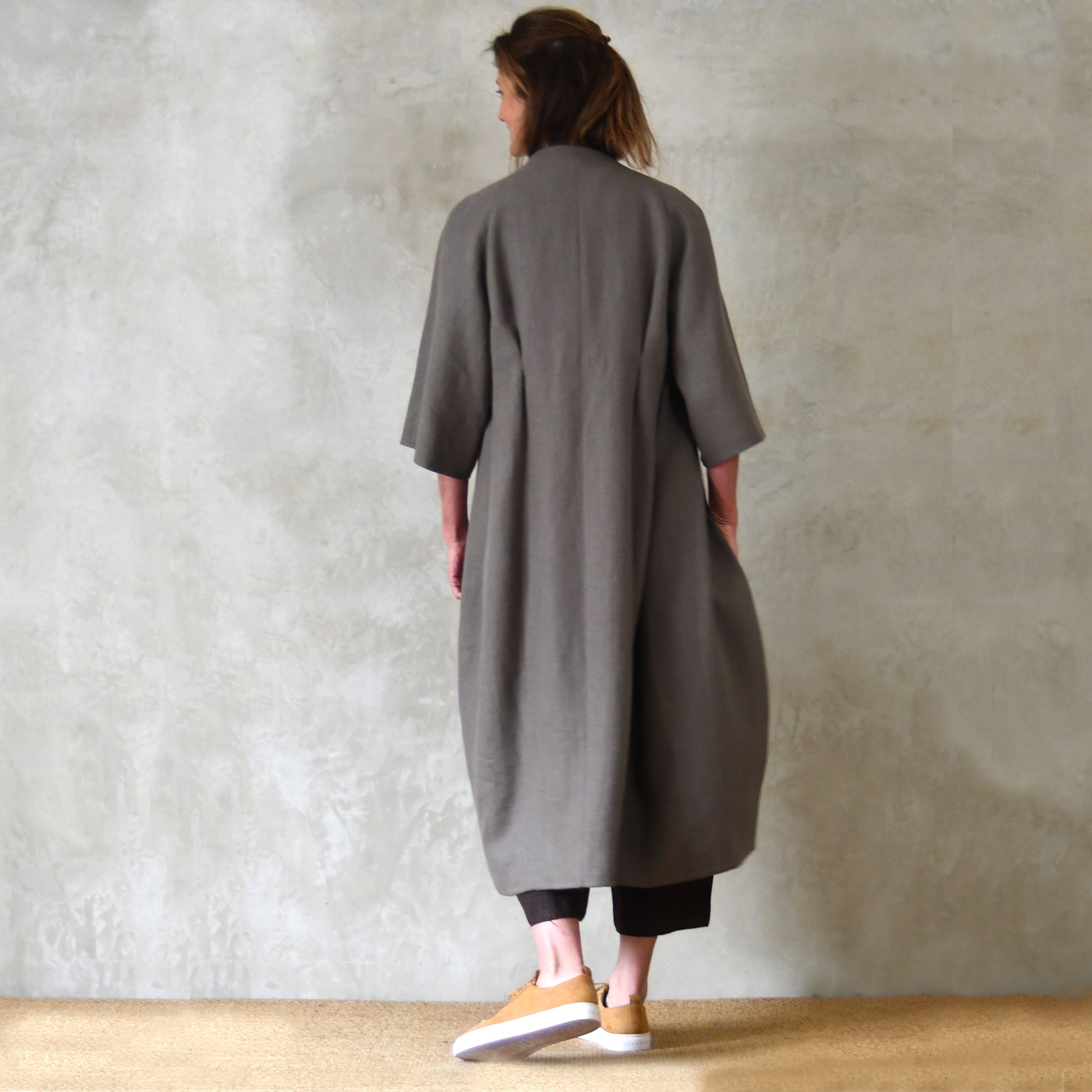 Longer Length Cocoon Coat in Irish Linen.  A slubby, relaxed linen makes for an easy to wear everyday coat that can be dressed up. Handmade in Britain. Rear View.