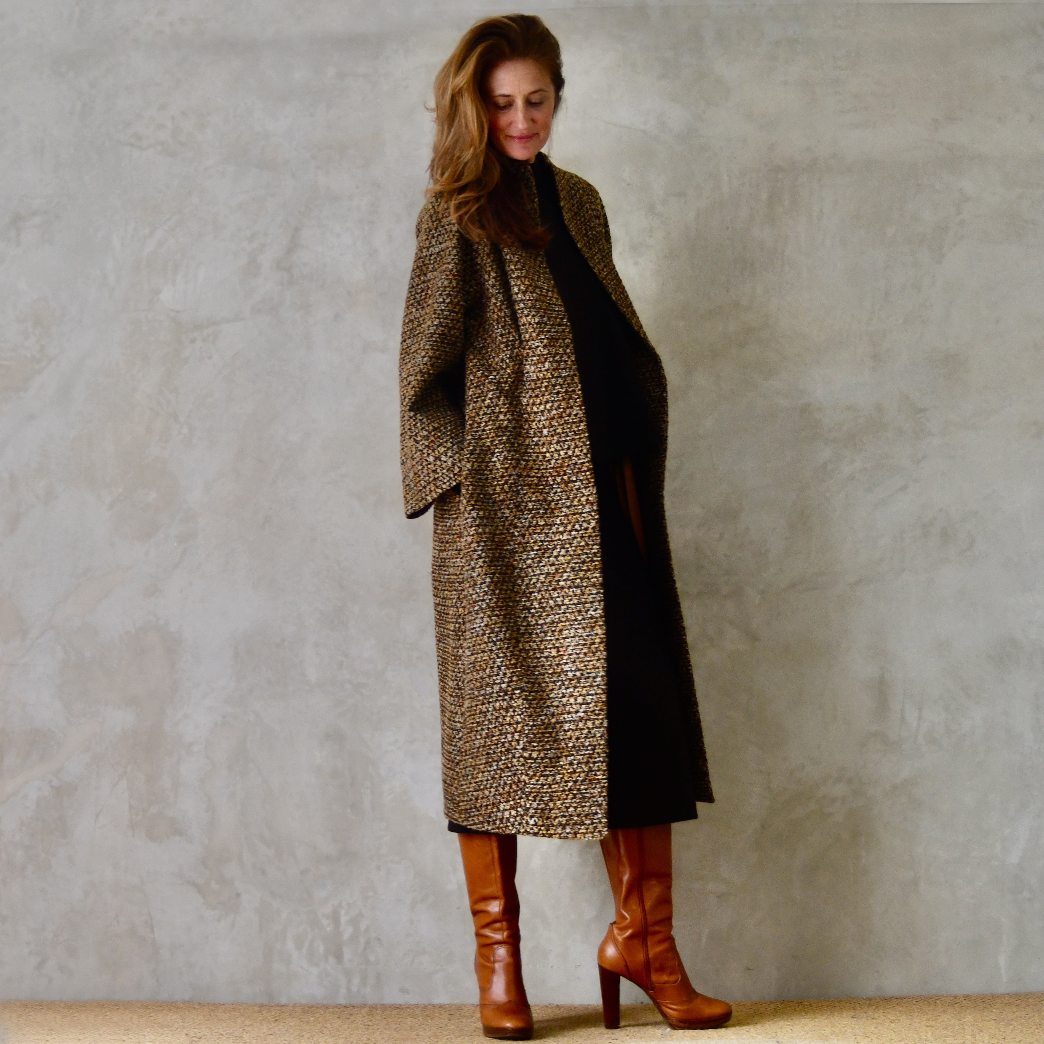 Longer Length Cocoon Coat in Golden Linton Tweeds Boucle. A dramatic, but incredibly wearable cocoon coat in a truly splendid boucle that will carry you well through Autumn and Spring. Handmade in Britain. Side View.