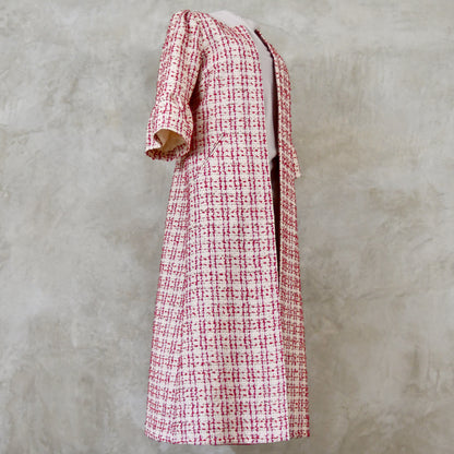 Bell Sleeve A-Line Coat in Pink Patterned Linton Tweeds Boucle. A pretty, longer length A-line coat in a pink, cream and gold check pattern for smart spring and summer occasions. Entirely made in Great Britain.