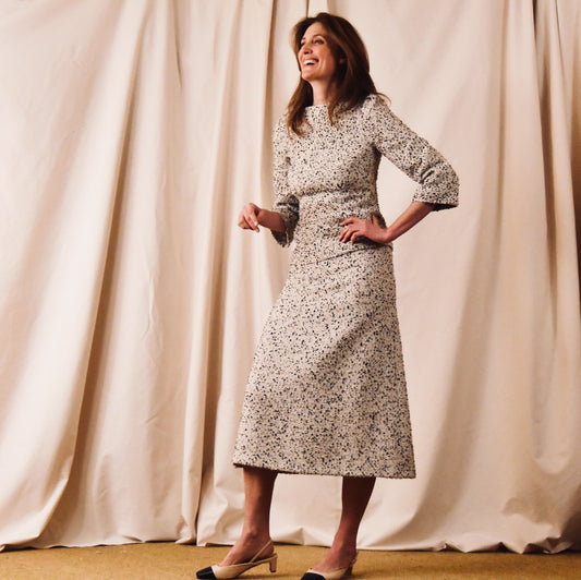 A tailored skirt suit in a light coloured Linton Tweeds bouclé – perfect for Royal Ascot and other formal occasions in spring and summer. Handmade in Britain. Full View.
