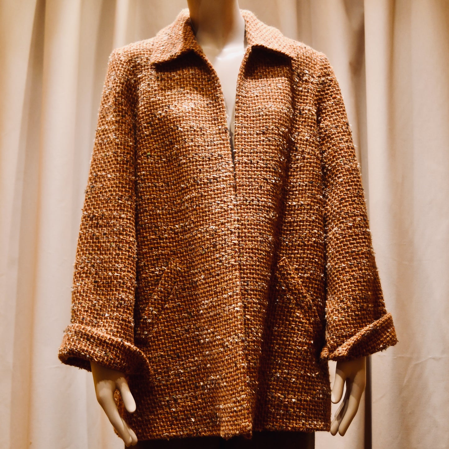Tailored Swing Jacket in Burnt Orange Wool Mix Bouclé from Linton Tweeds. A women’s long-sleeve, collared coat with slanted front pockets. Sophisticated and easy. Handmade in Britain.