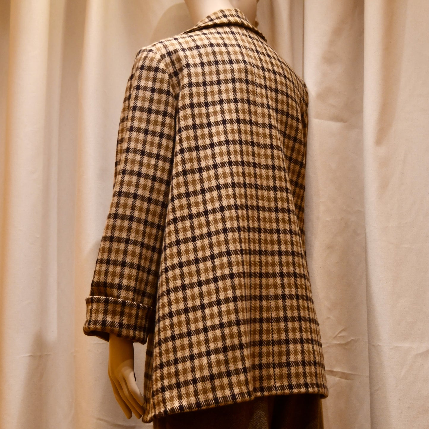 Swing Jacket in Gunclub Check Merino Flannel, featuring long sleeves and a collar. Flannel from Fox Brothers. Handmade in Great Britain. Side Rear View.