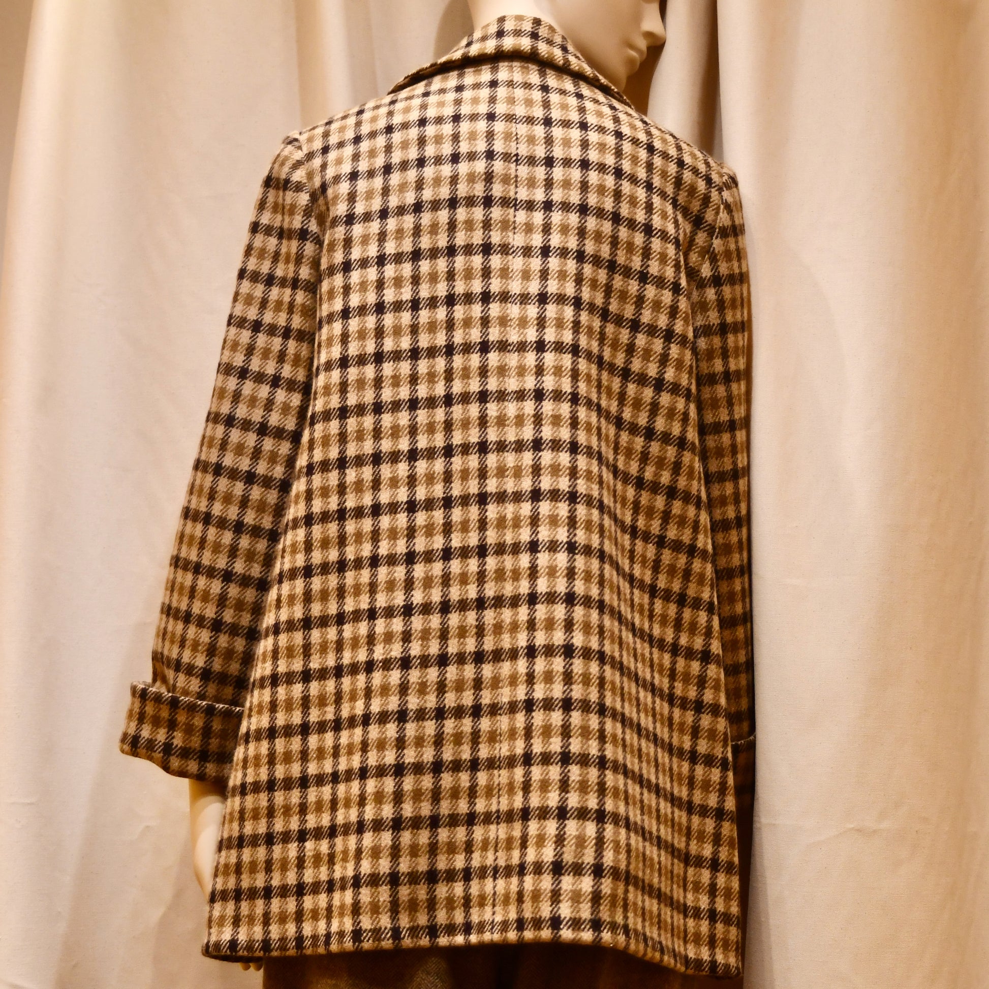 Swing Jacket in Gunclub Check Merino Flannel, featuring long sleeves and a collar. Flannel from Fox Brothers. Handmade in Great Britain. Rear View.