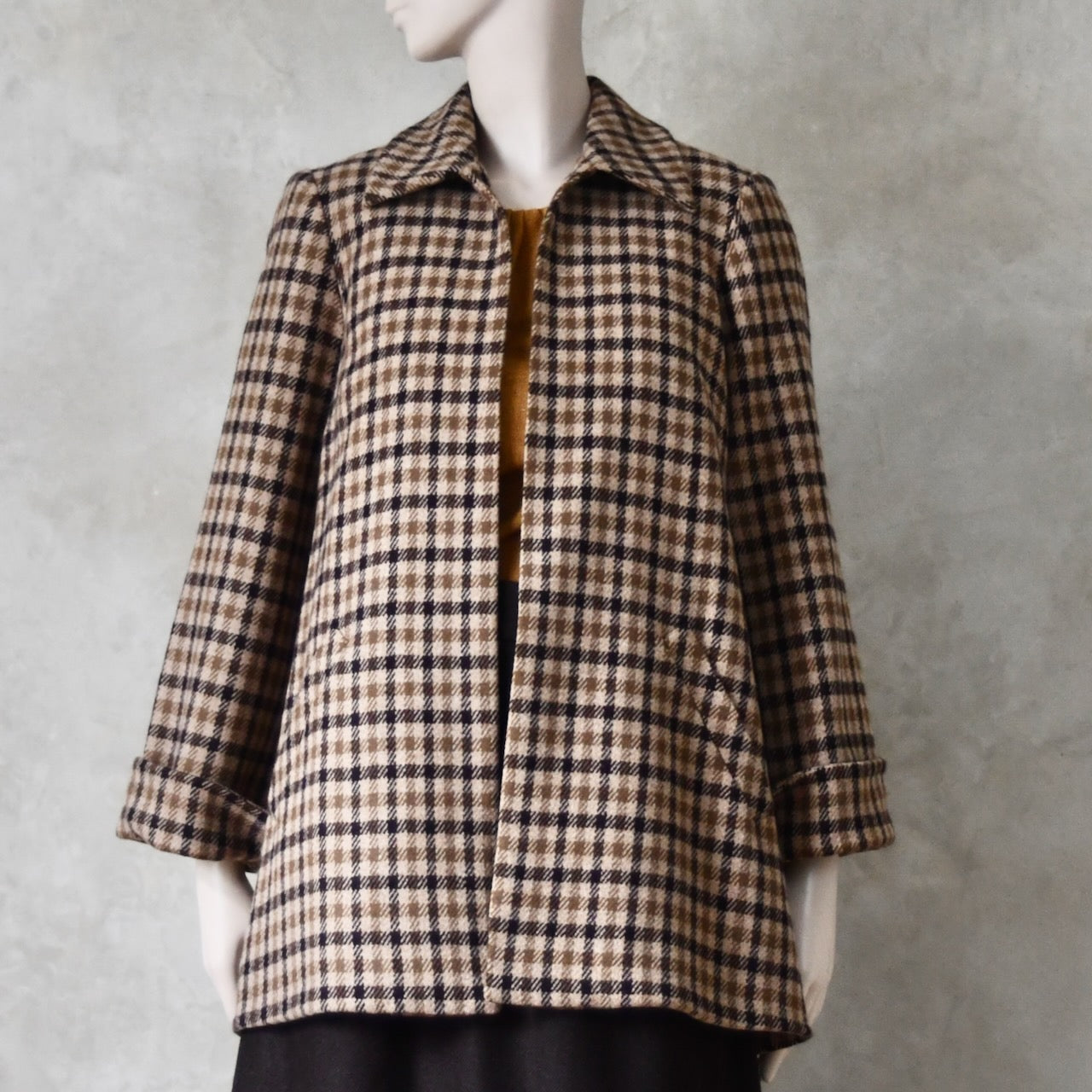 Swing jacket in pure merino wool. An easy to wear mid length jacket with pockets and a generous collar in Fox Brothers gunclub check flannel. A generous pure merino flannel this is the softest fabric you will touch and will last for eons. Handmade in London. Sizes 6 to 20 and bespoke sizing available.