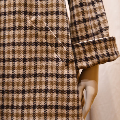 Swing Jacket in Fox Flannel Gunclub Check, featuring brown and creaam checks with long sleeves. Handmade in Britain. Close-up of slanted pocket, and cuffed sleeve.