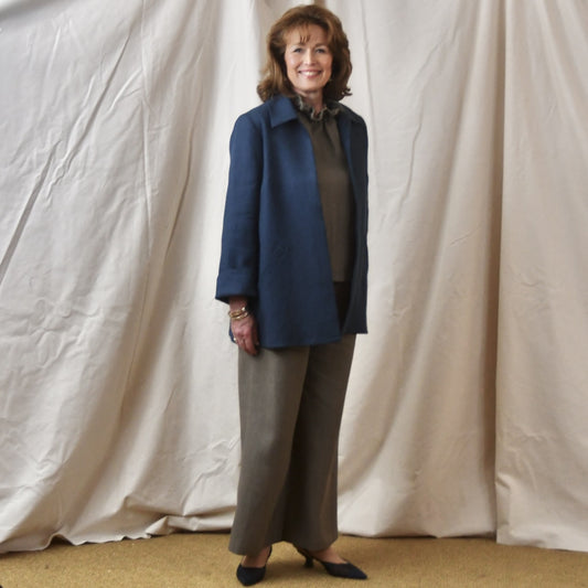 Navy Swing Jacket in Irish Linen. Easy and elegant jacket with cuff detail, slant pockets and a wide neck. Handmade in Britain. Side View.