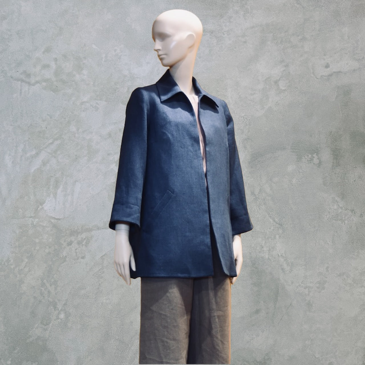Navy Swing Jacket in Irish Linen. Easy and elegant jacket with cuff detail, slant pockets and a wide neck. Handmade in Britain.