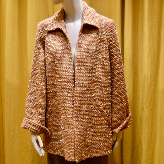 Tailored Swing Jacket in Burnt Orange Wool Mix Bouclé from Linton Tweeds. This bespoke jacket has rolled cuffs and a textured finish and a flared silhouette. Shown from the front. Handmade in Britain.
