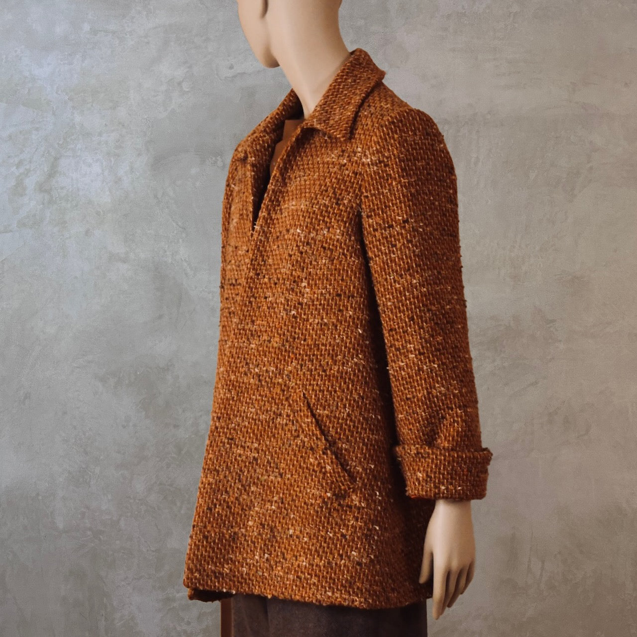 The EdNerat Swing Jacket in burnt orange wool mix bouclé from Linton Tweeds. Handmade in Britain.