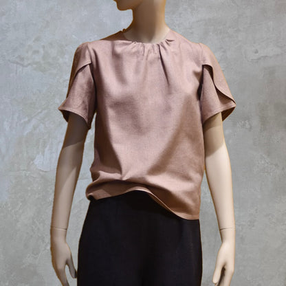 A bespoke lime green coloured Tulip Sleeve Blouse in Pale Pink Silk Matka, paired with an orange midi skirt.Handmade in Britain. 