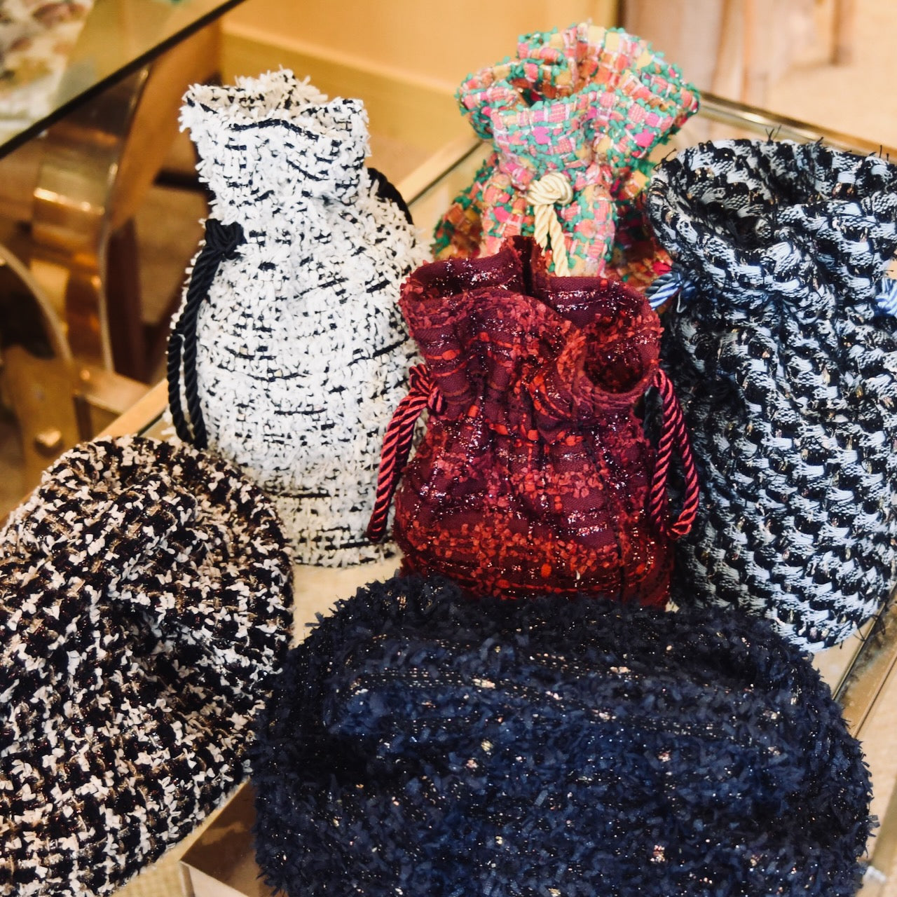 Linton Tweeds Cut offs from EdNerat repurposed into bucket and clutch bags. Perfect for Christmas presents. Handmade in Abergavenny.
