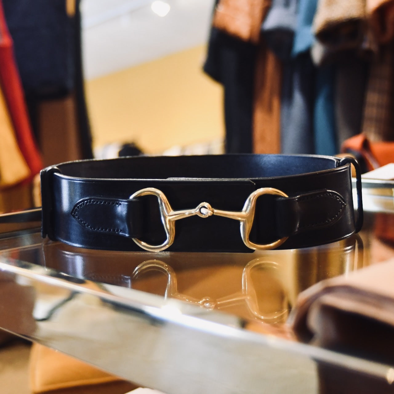 A Boxed saddle Leather Belt.  The EDNERAT Black Adjustable Bit Belt 80-95 cm, crafted from British saddle leather with a brass horse bit buckle and solid brass fittings. Handmade in Britain.