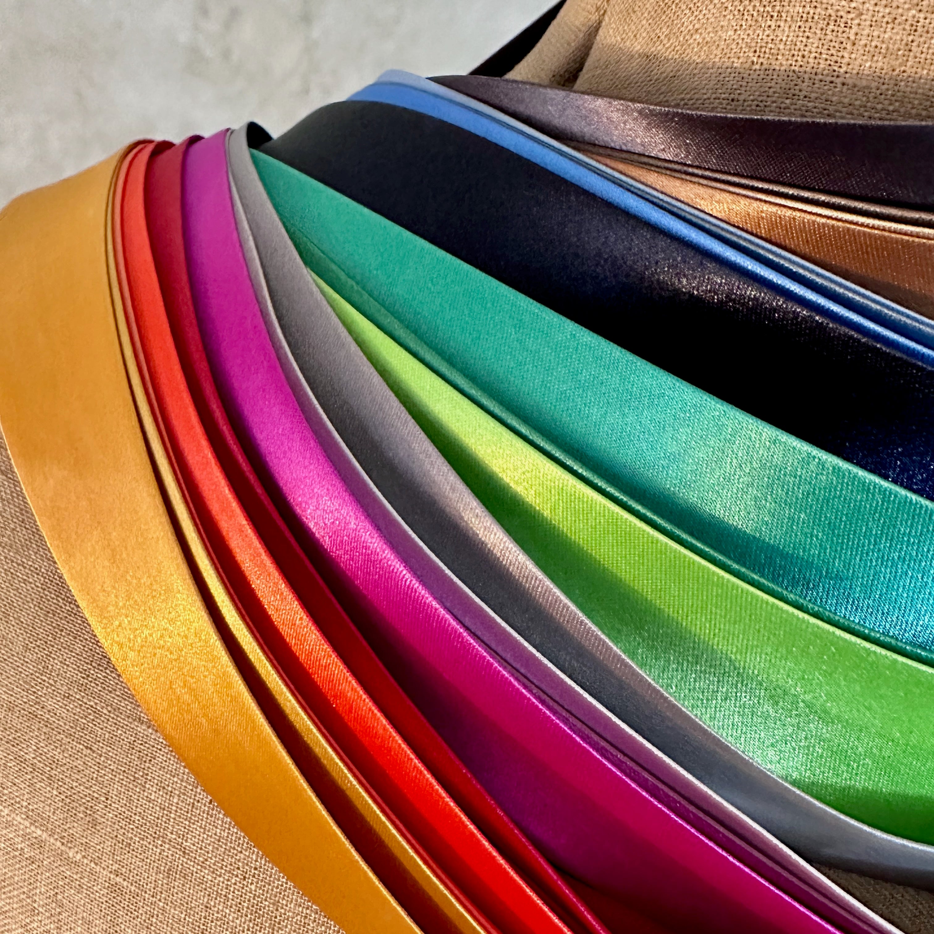 Satin Trims for EdNerat Coats Handmade in London. EdNerat's Coats are lined in coloured silks and trimmed inside with satin strips. 