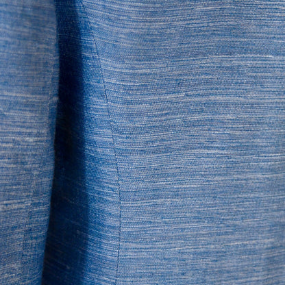 Close-up of the blue Silk Madras fabric on EdNerat Hourglass Coat Faience, highlighting visible weave patterns and a central seam—ideal for a summer coat or a tailored hourglass silhouette. Handmade in Britain. 
