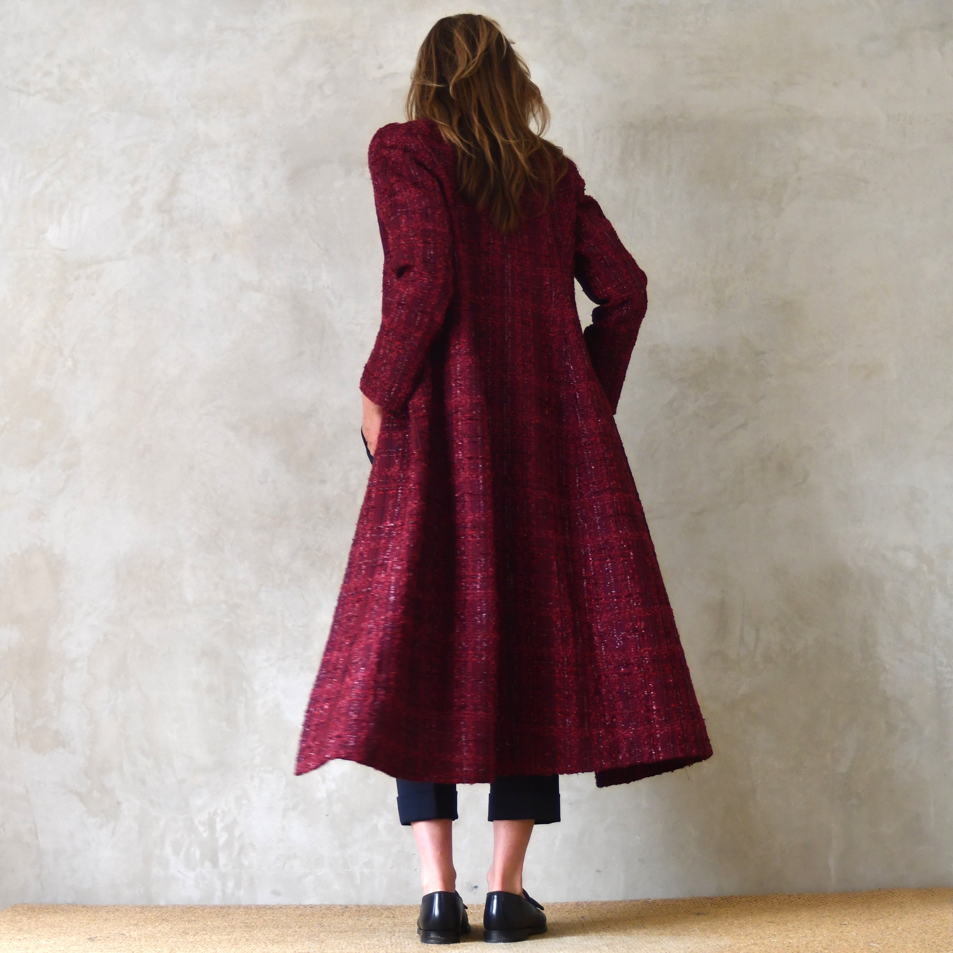 Fitted Hourglass Coat in Wine-Coloured Linton Tweeds Boucle. A Fitted Invesment Piece Perfect for Evening Wear and Smart Occasions. Handmade in Britain. Rear View.