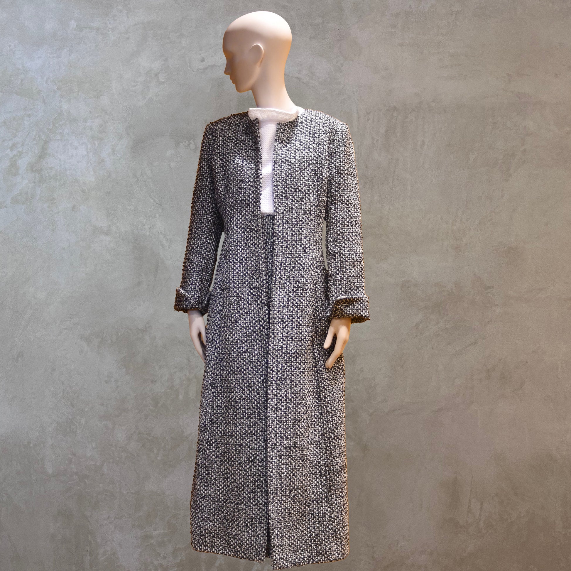 Fitted Longline Hourglass Coat in Linton Tweeds Black and White Boucle. An investment piece for Ascot, Weddings and Work. Handmade in Britain. Front View Closed With Skirt