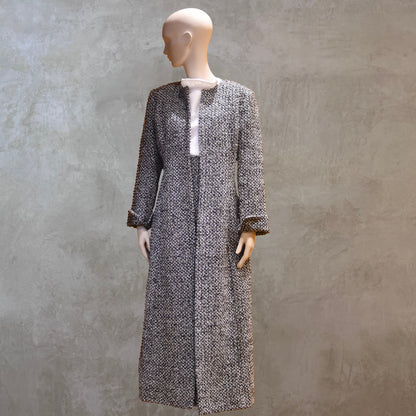 Fitted Longline Hourglass Coat in Linton Tweeds Black and White Boucle. An investment piece for Ascot, Weddings and Work. Handmade in Britain. Front View Closed With Skirt