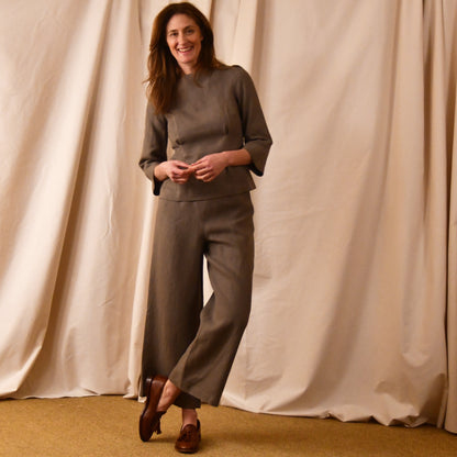 EdNerat’s Tailored Boat Neck Blouse in a slubby Irish linen in a light brown colour.  Handmade in Britain. Shown with matching wide-leg pants.