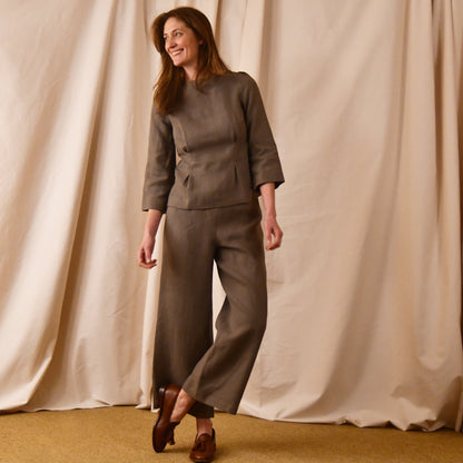 A Tailored Boat Neck Blouse in Brown Irish Linen. Fitted and elegant the top is shown over a matching loose fitting Linen Pants. Handmade in Britain.