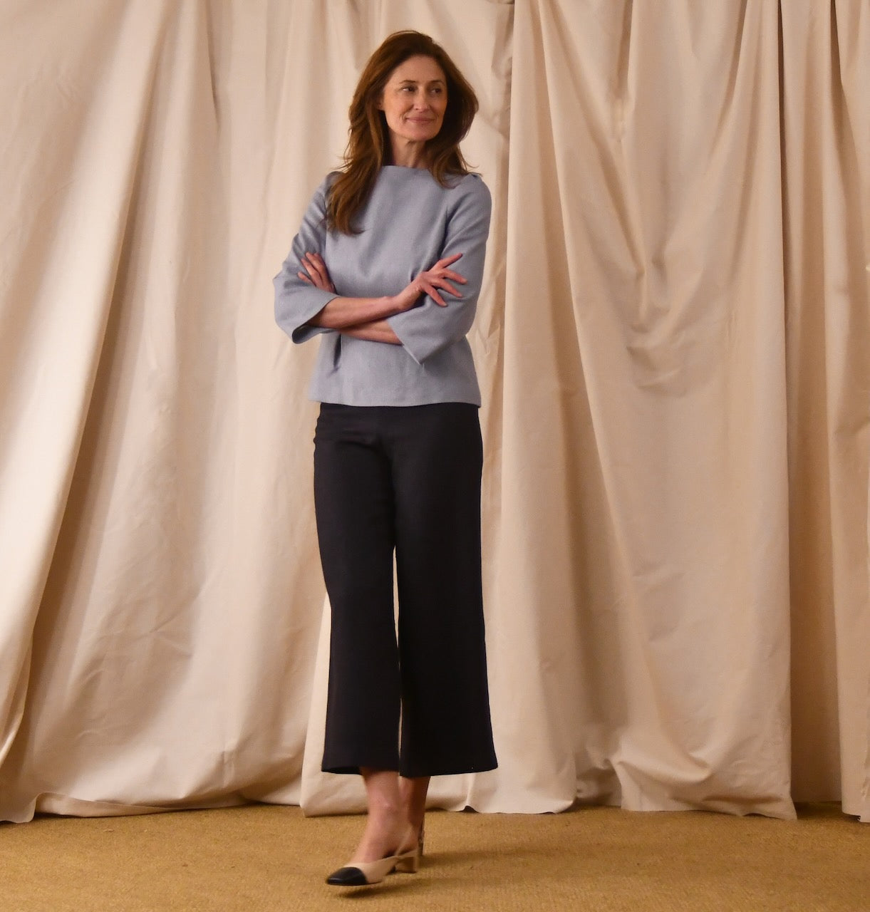 A Tailored Boat Neck Blouse in Pale Blue Silk Matka. Handmade in Britain. A refined ensemble defined by elegant lines.