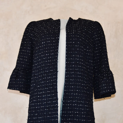 Bespoke Navy Boucle Coat with Bell Sleeves. This is a navy, black, and white cotton boucle fabric from Linton Tweeds. Handmade in Britain. 