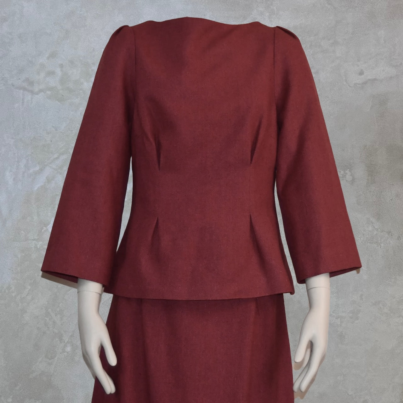 Bespoke Tailored Boat Neck Blouse in Silk Matka, featuring tucks at the waist and wide sleeves with shoulder detail. Shown paired with a matching skirt. Handmade in Britain.