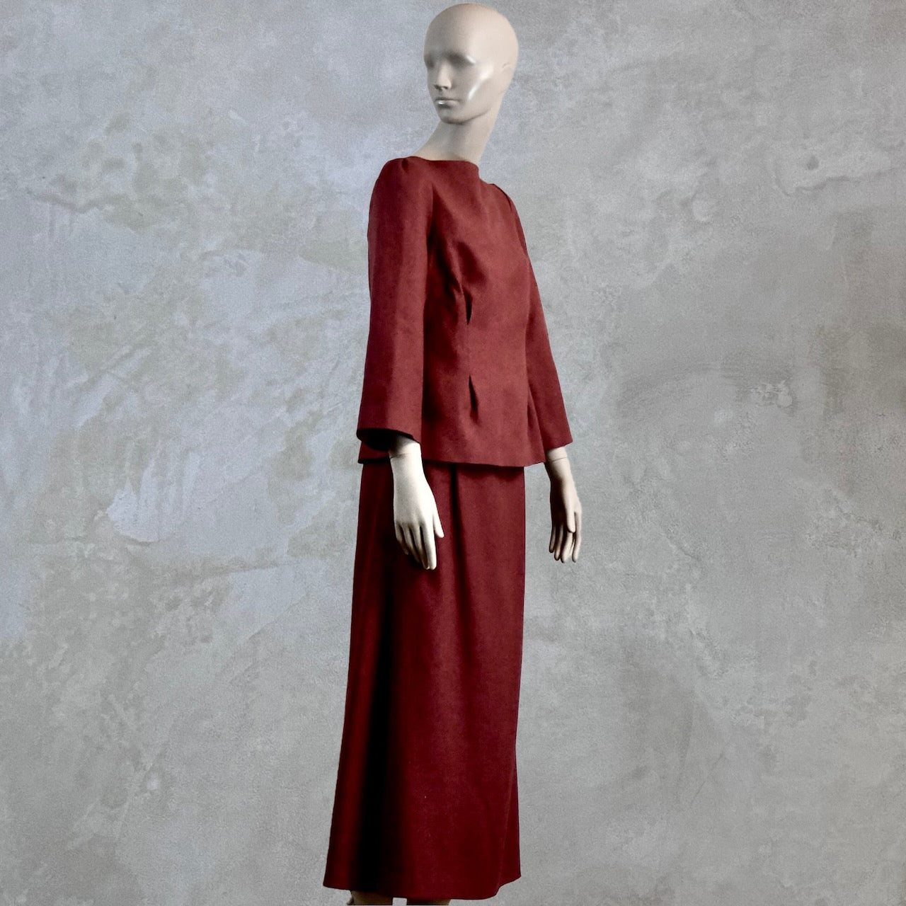 A Waisted A-Line Skirt in Silk Matka with a long-sleeved, dark red boat neck top. A minimalist, elegant design, perfect in silk for summer weddings. Handmade in Britain.