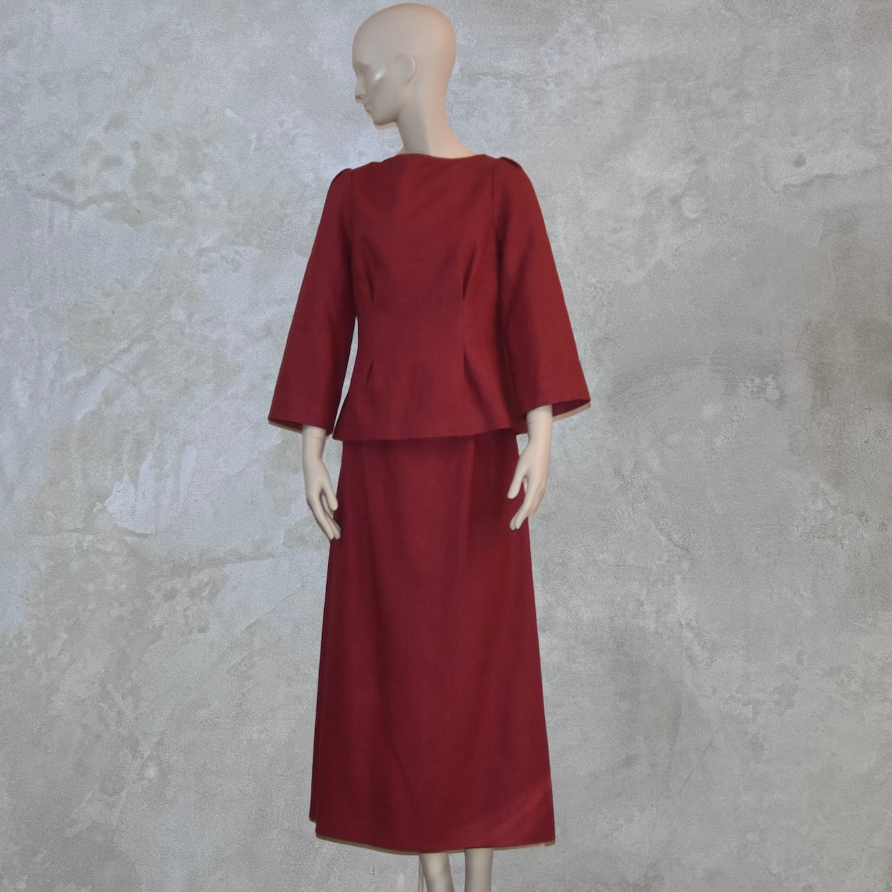 A Waisted A-Line Skirt in Silk Matka with a long-sleeved, dark red boat neck top. A minimalist, elegant design, perfect in silk for summer weddings. Handmade in Britain.