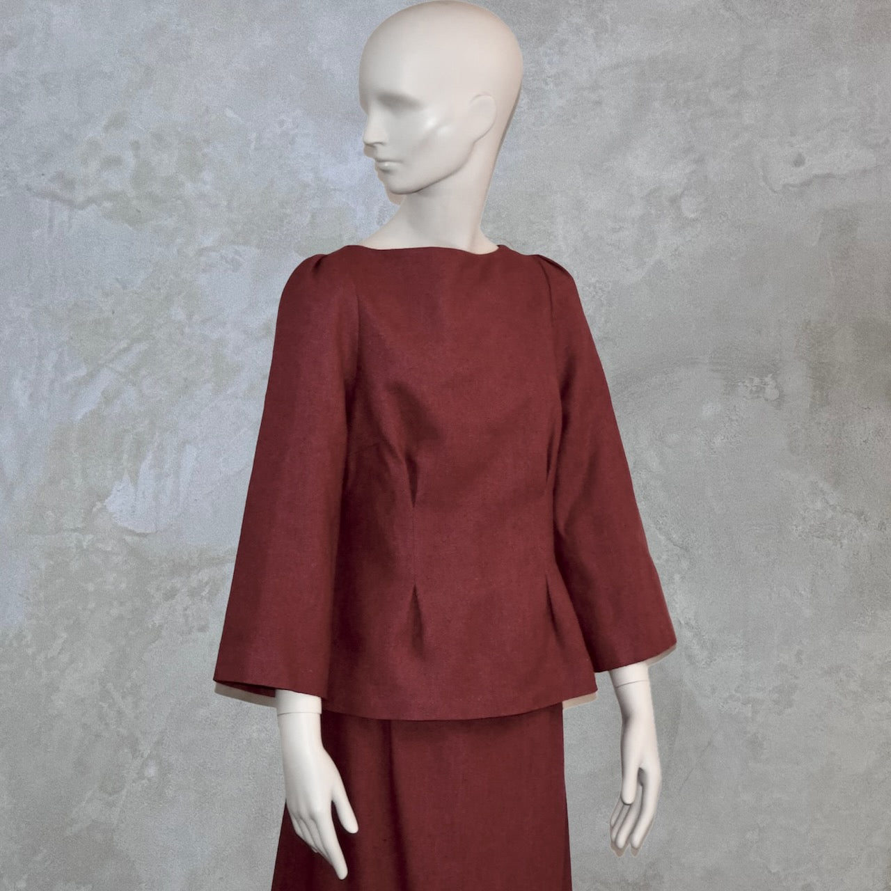 Front view of a Tailored Boat Neck Blouse in Dark Pink Silk Matka with a matching skirt. Handmade in Britain.
