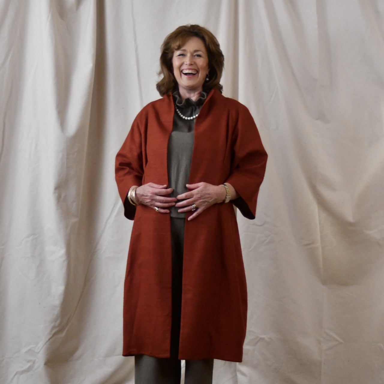 Summer Weight Cocoon Coat in Terracotta Silk. A Bespoke Silk Matka Cocoon Shaped Coat with under-bust and rear gathers, creating a shapely silhoutte.
Handmade in Britain. Open View.