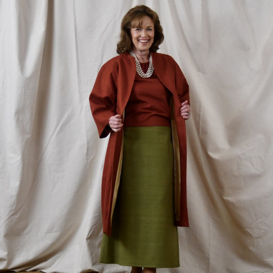 Summer Weight Cocoon Coat in Terracotta Silk. A Bespoke Silk Matka Cocoon Shaped Coat with under-bust and rear gathers, creating a shapely silhoutte.
Handmade in Britain.