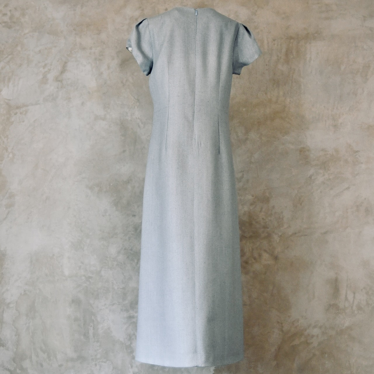 An A-Line Bell Sleeve Coat and Dress in Light Blue Silk Matka. A long, short-sleeved blue woven dress with an A-Line cut. Handmade in Britain. Dress Back View.