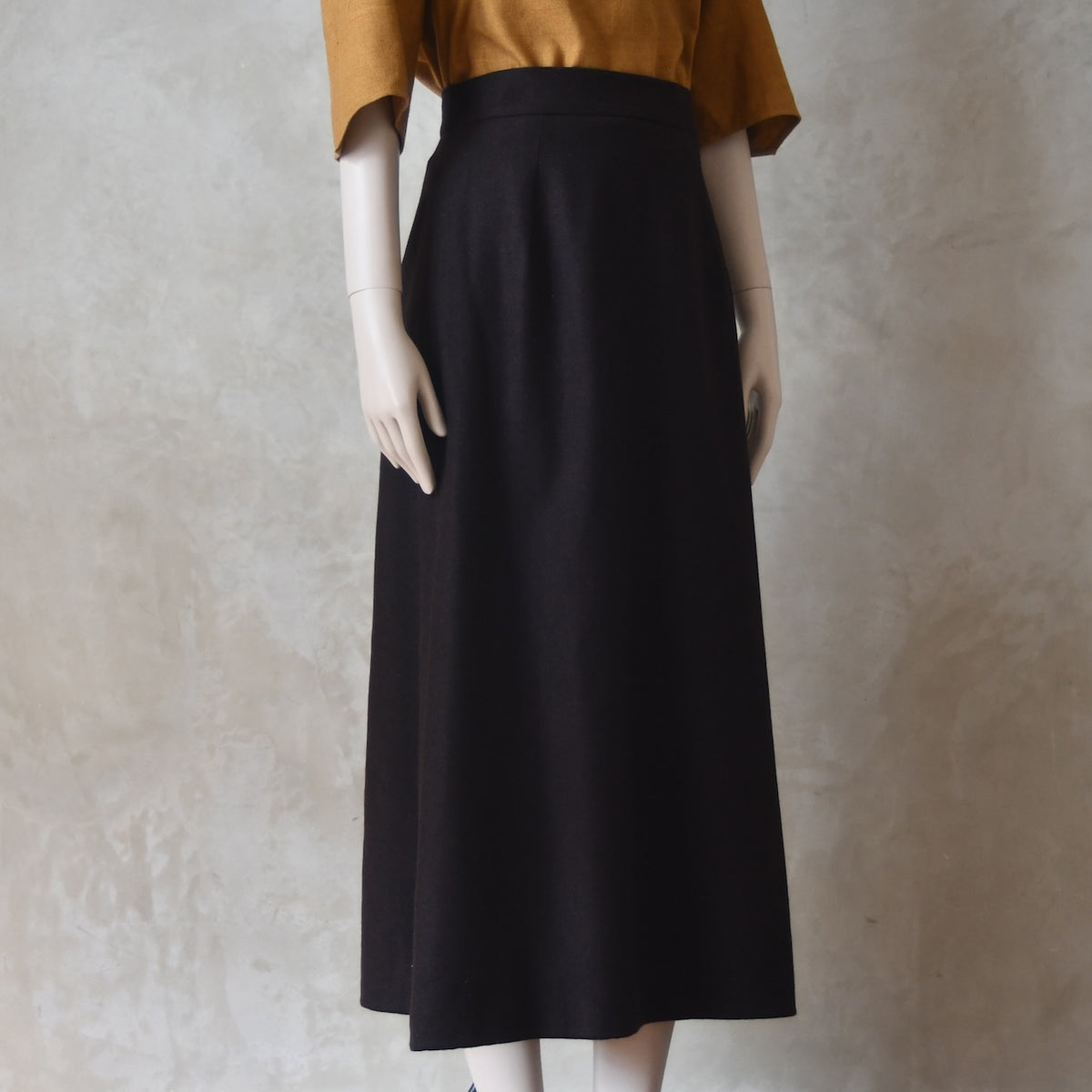 Side view of Brown Merino A Line Skirt. Lined in Silk and Handmade in London.