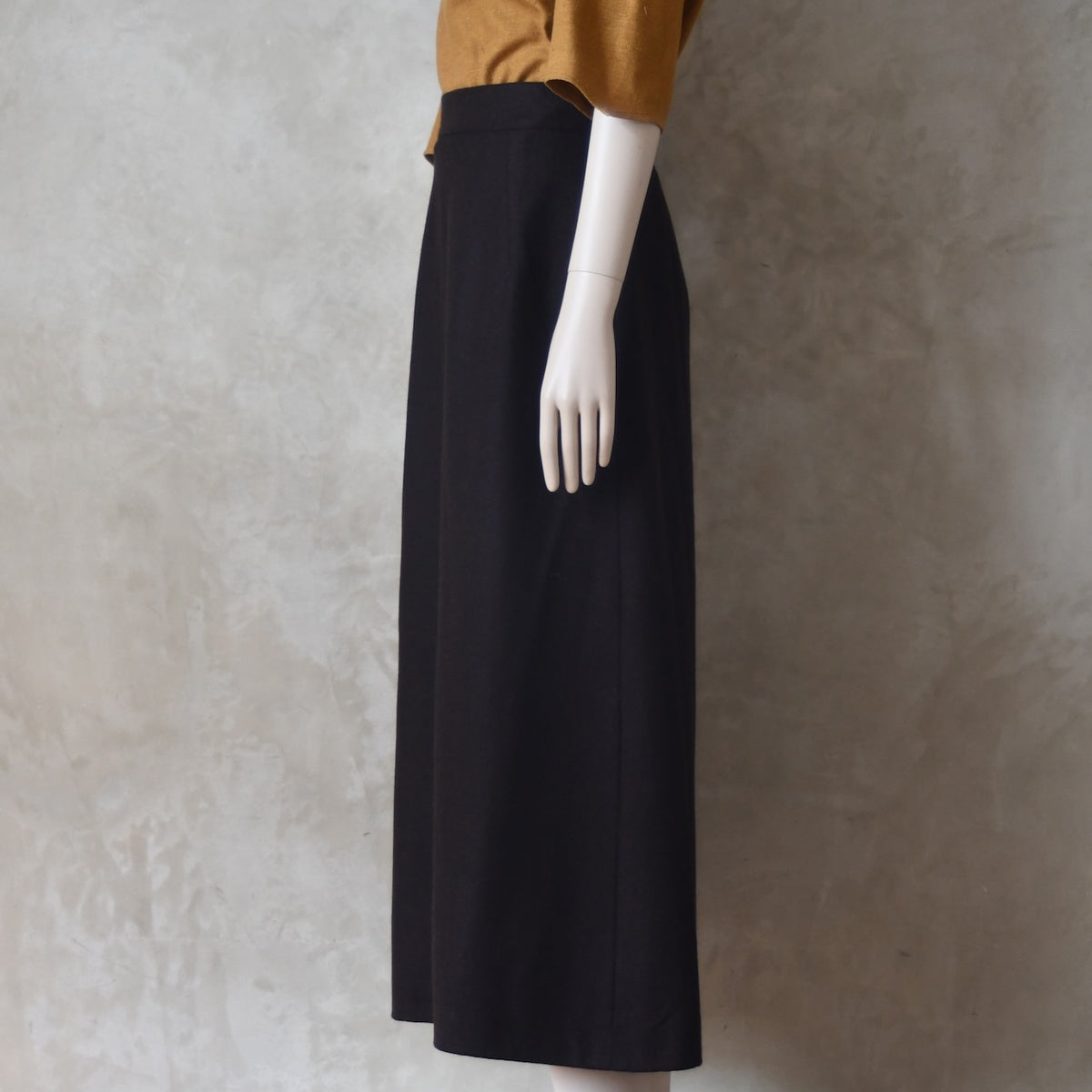Side view of Brown Merino A Line Skirt. Lined in Silk and Handmade in London.