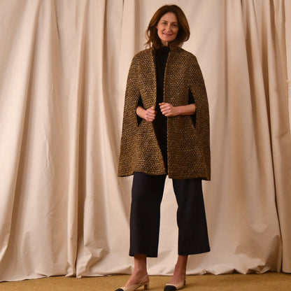 The Long Clayton Cape in Golden Linton Tweeds Boucle. A mid length, easy to wear cape for dressing up or down, mid-season and summer wear. Handmade in Britain.