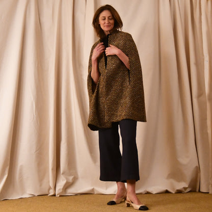 The Long Clayton Cape in Golden Linton Tweeds Boucle. A mid length, easy to wear cape for dressing up or down, mid-season and summer wear. Handmade in Britain.