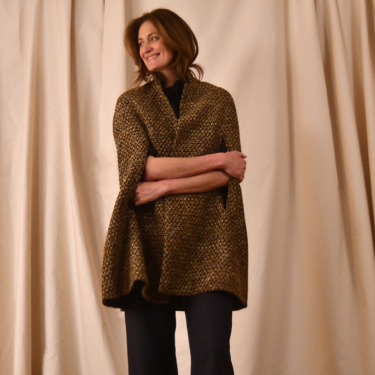 The Long Clayton Cape in Golden Linton Tweeds Boucle. A mid length, easy to wear cape for dressing up or down, mid-season and summer wear. Handmade in Britain.